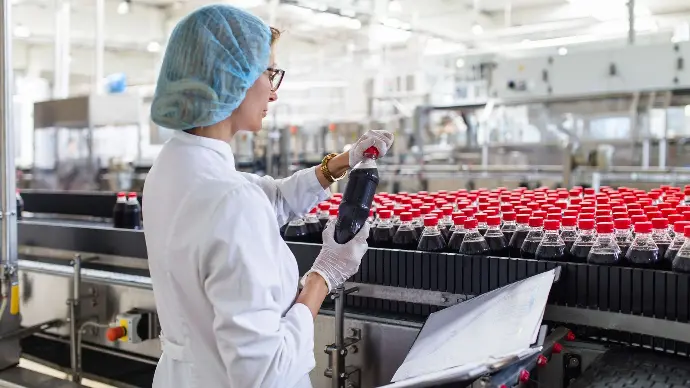 image of a woman checking products quality